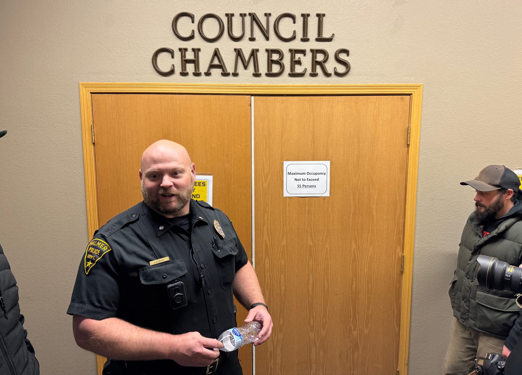 Palmer Police Commander Shayne LaCroix stands outside the Palmer City Council chambers