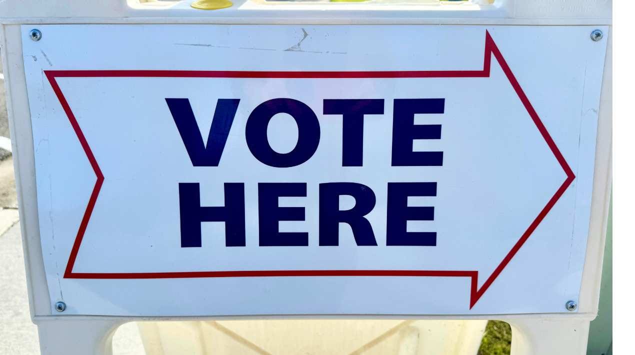 "Vote here" sign