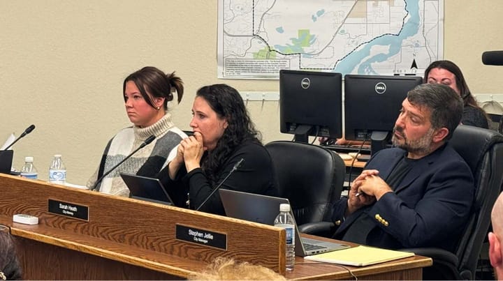 Palmer city manager Stephen Jellie, right, sits next to city attorney Sarah Heath and council member Victoria Hudson 