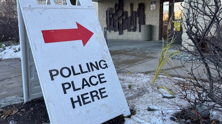 A "polling place here" sign